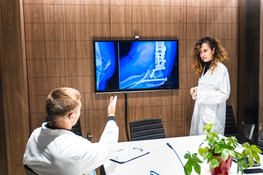 surgeons analyzing spinal x-ray