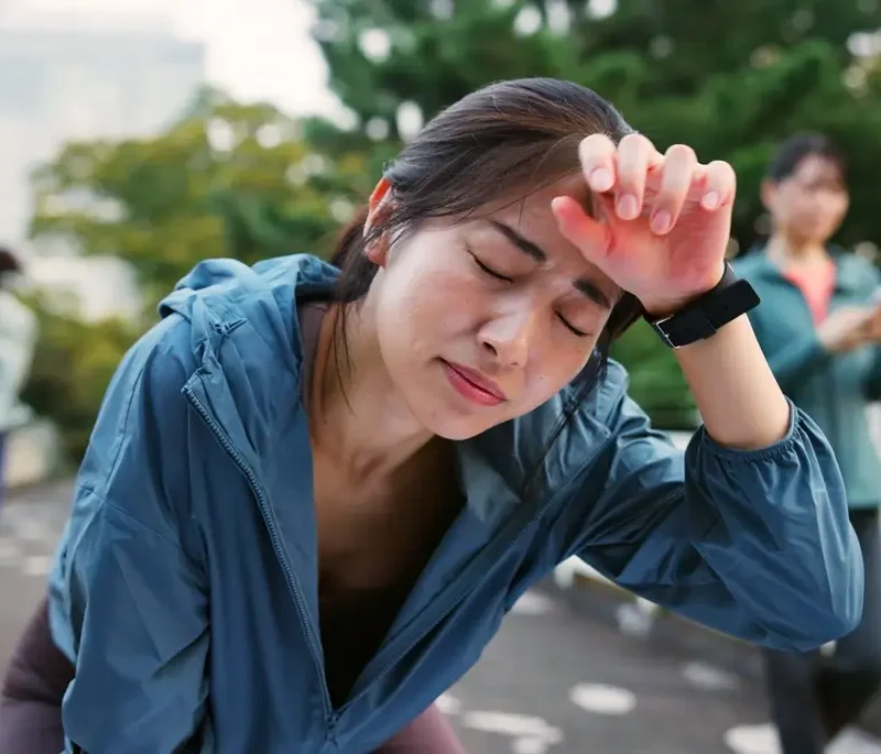 woman experiencing fatigue and dizziness due to low hemoglobin levels