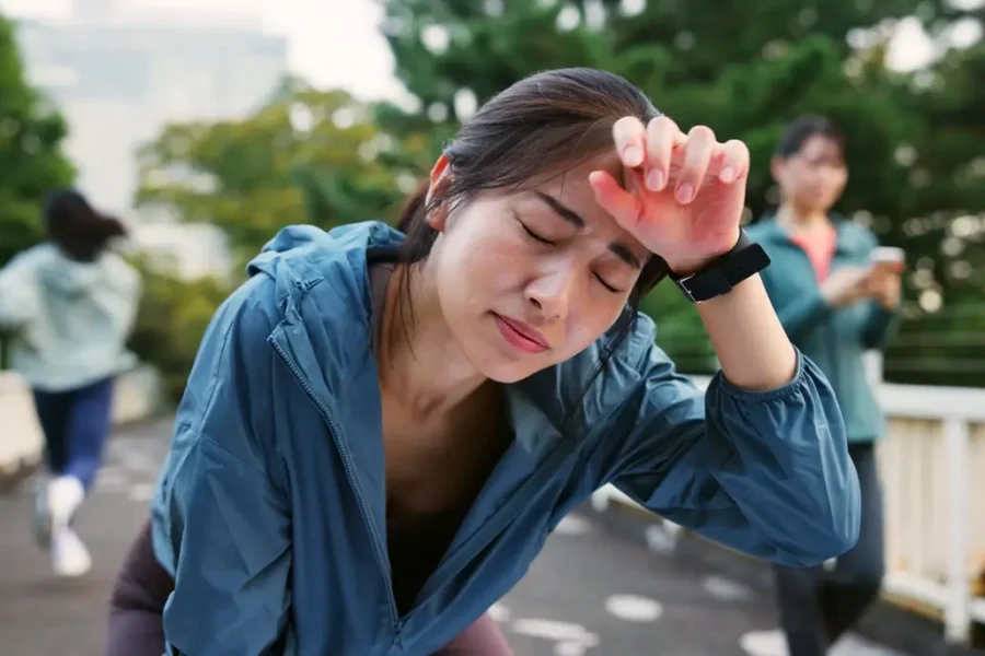 woman experiencing fatigue and dizziness due to low hemoglobin levels