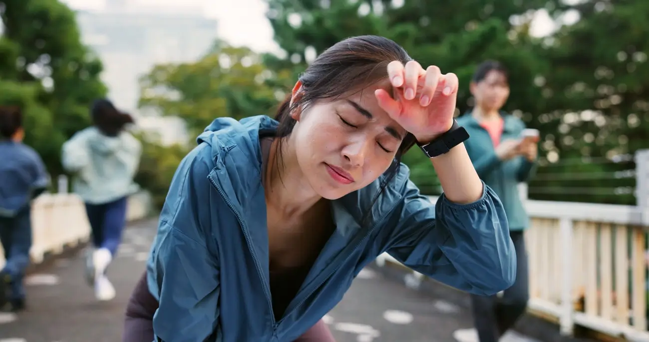 woman experiencing fatigue and dizziness due to low hemoglobin levels